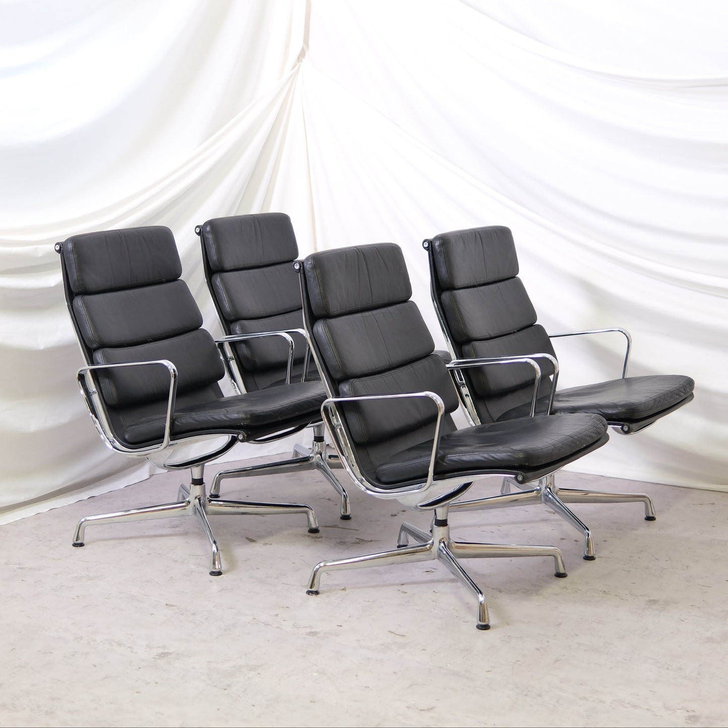 Vitra EA 215 lounge chair in black leather with polished aluminium frame