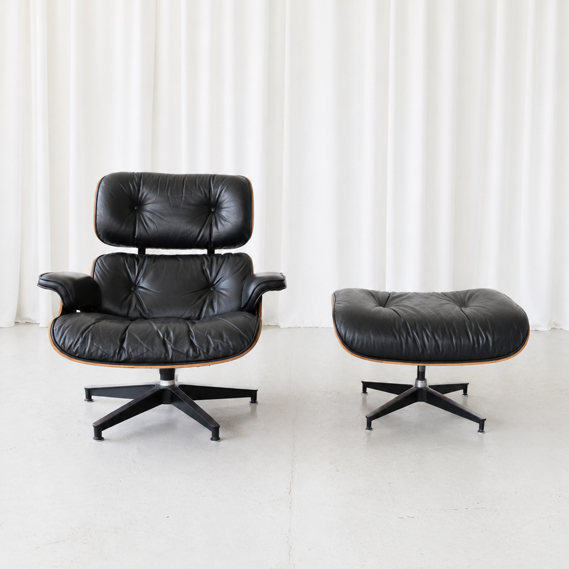 Eames Lounge Chair and Ottoman by Herman Miller in Rosewood and Black Leather
