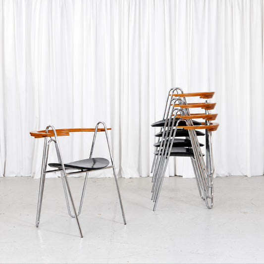 Five Pentti Hakala W chairs shown stacked beside one chair