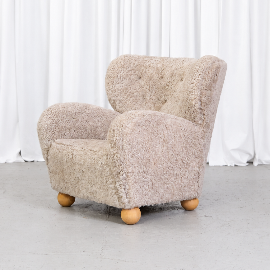 Vintage Danish sheepskin armchair, front angle