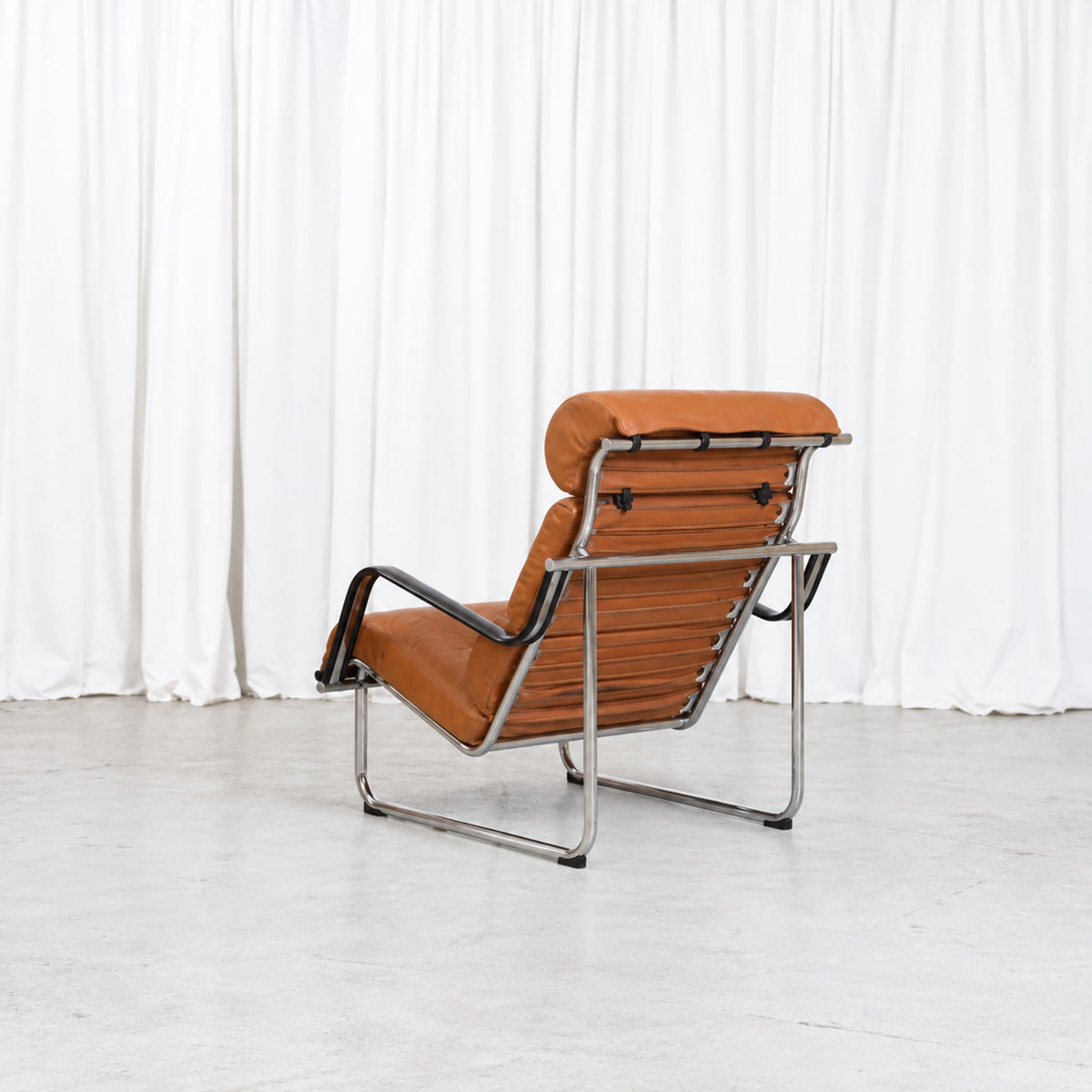 Yrjö Kukkapuro Remmi lounge chair in cognac leather, rear view